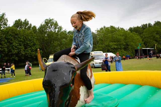 Bretton Festival. Anastasia (11) rides the mechanical bull, not for long.,
Bretton, Peterborough
07/07/2019. 
Picture by Terry Harris / Peterborough Telegraph. THA