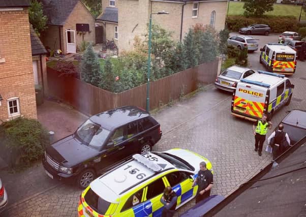 Police carrying out the warrants this morning. Photo: Vikki Cooke