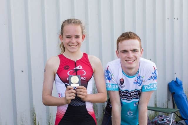 Calleigh Coull won the 11-12 year-olds race and received her trophy from Jonathan Oakley. Photo: Steve Hope.
