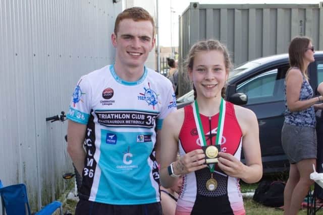 Elizabeth Eames won the 13-14 year-olds race. She's pictured with PACTRAC junior star Jonathan Oakey.