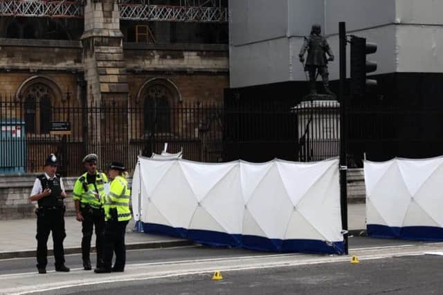Police and forensic officers at the scene of the attack. (Photo: Getty)