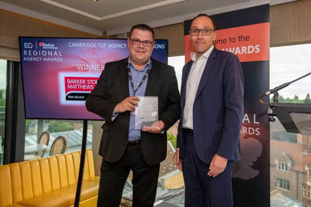 BSMs Julian Welch, left, collects the  Top Agency Instructions award from Damian Wild, editor of Estates Gazette.
