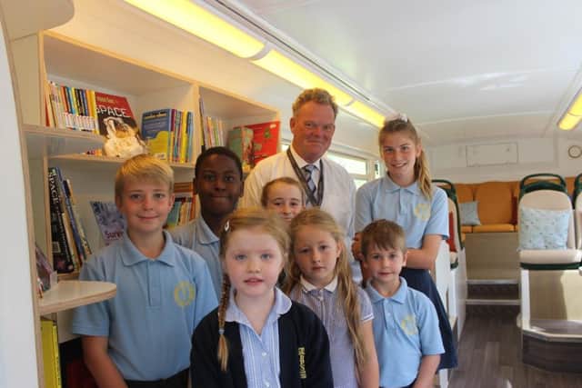 Cllr Robewrt Reid with pupils at Baston primary.