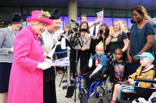 Queen Elizabeth II meets children during a visit to Royal Papworth Hospital. Photo: Joe Giddens/PA Wire