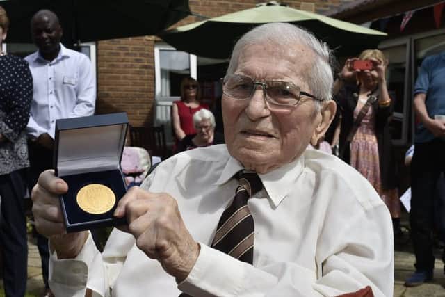 George Hockney (100) a Park House resident, receives the Norwegian Commemorative Medal from  Col. john Andreas Olsen for his service in the Royal navy in WW2 EMN-191007-153344009