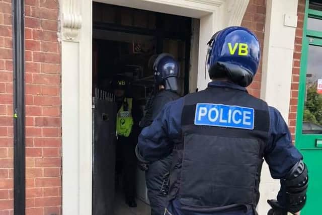 Police carrying out a raid in London Road. Photo: Cambridgeshire police