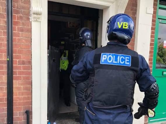 Police carrying out a raid in London Road. Photo: Cambridgeshire police