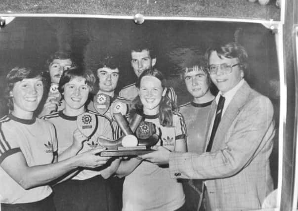 Bob French presents an indoor mixed hockey trophy to Bretton Beavers in the 1980s