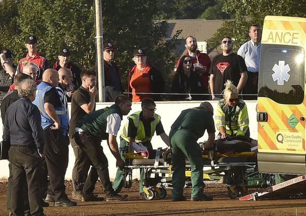 Josh Bates is taken away by paramedics after his nasty crash at the East of England Arena. Photo: David Lowndes.