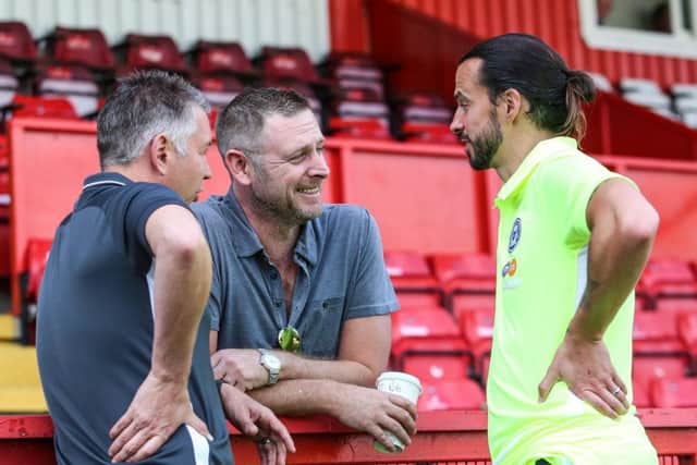 Posh boss Darren Ferguson, chairman Darragh MacAnthony and new signing George Boyd at Stevenage. Photo: Joe Dent