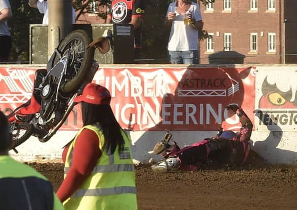 Josh Bates lies prostrate on the ground as his bike flies through the air during the meeting with Belle Vue. Photo; David Lowndes.