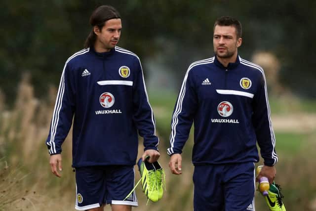 George, from Kent, played twice for Scotland, making his debut in Serbia in 2013 and playing his final game against NIgeria the following year. He's pictured at training with Russell Martin, also an ex-Posh player.