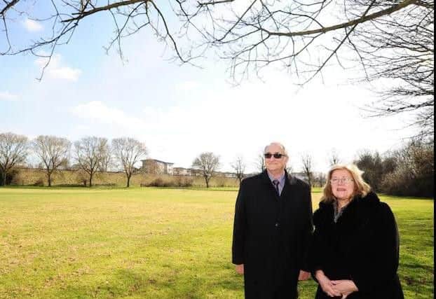 Peterborough City Council leader Cllr John Holdich, and cabinet member for the university Cllr Lynne Ayres, at the Embankment site for the new University of Peterborough campus