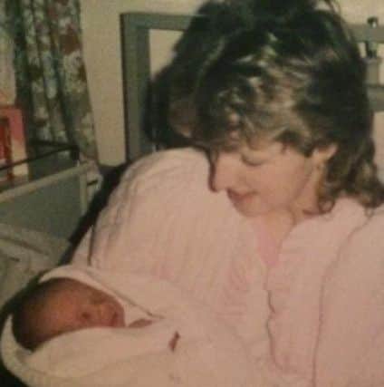 Christine holding Holli as a baby