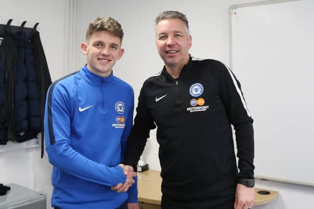 Kyle Barker with Posh first-team manager Darren Ferguson.