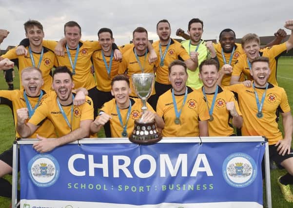 Whittlesey Athletic FC celebrate their Peterborough Senior Cup FInal success last season.