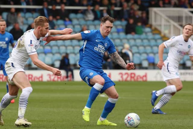 Callum Cooke in action for Posh last season.