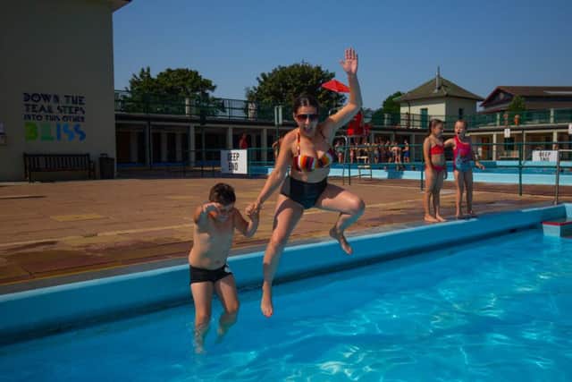 Huge numbers of people visiting Peterborough Lido. Photo: Terry Harris