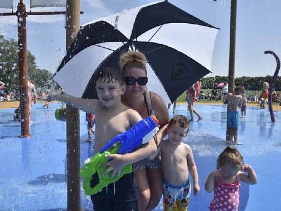 Members of the Clay and Hill families cooling off in the hot weather at Bretton Water Park
