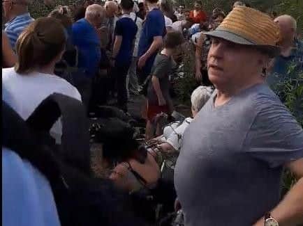Passengers by the side of the train. Photo and video from Caire Knights