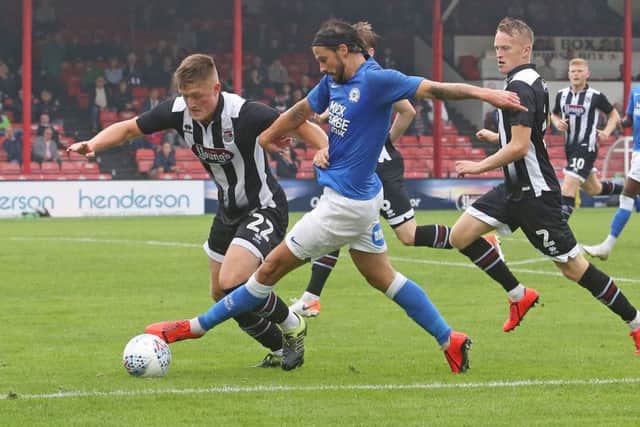 George Boyd in action for Posh at Grimsby. Photo: Joe Dent/theposh.com.