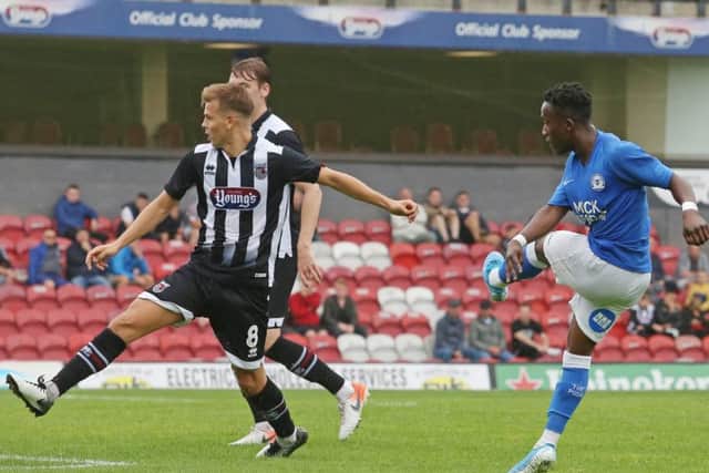 Siriki Dembele scores for Posh at Grimsby. Photo: Joe Dent/theposh.com