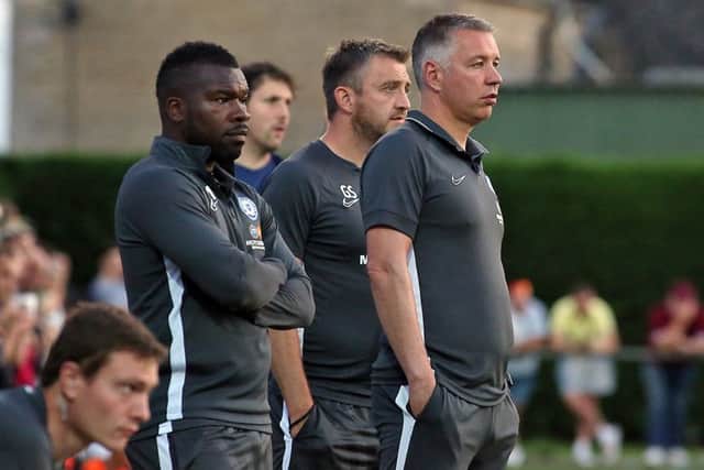 Darren Ferguson and his coaching staff watch Posh at Deeping Rangers. Photo: Joe Dent/theposh.com.