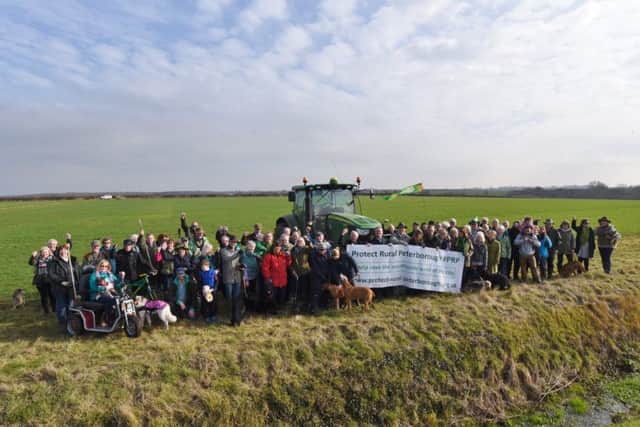 Castor, Ailsworth and Upton residents gather at the proposed development site 200 meteres from the Castor Hanglands EMN-170215-161941009