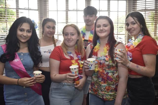 Madeline Yerrell, Abigail Cumbridge, Cora Stock, Alison Magnus (back) Shannon Taylor and Sam Greenhalgh at a Caribean party at the Black Bull, Whittlesey in aid of Together for Short Lives charity EMN-190721-204914009
