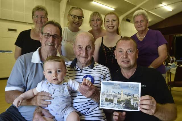 100-year-old Douglas Wilson celebrating his birthday in Yaxley with members of his family EMN-190726-115435009
