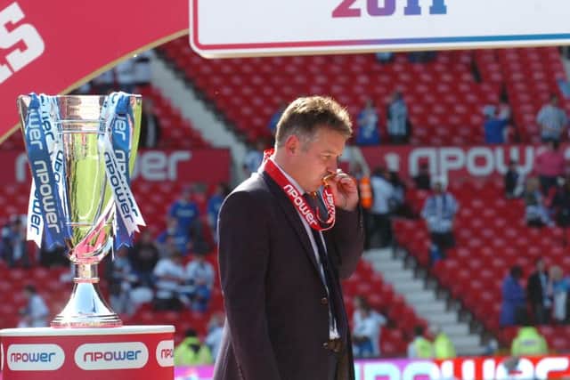 Posh boss Darren Ferguson kisses his medal after victory over Huddersfield in the 2011 League One play-off final.