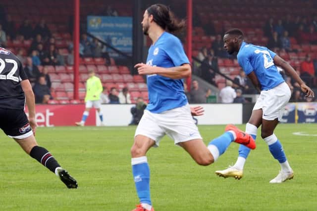 Mo Eisa scores from long range for Posh at Grimsby.