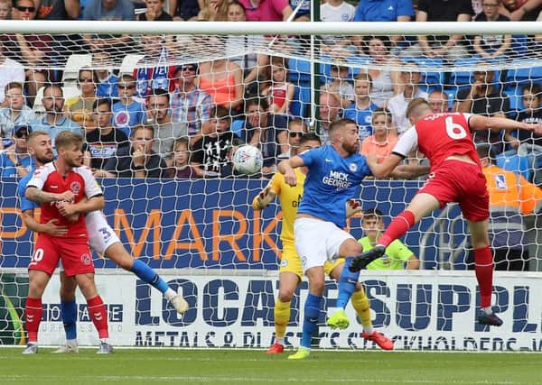 Harry Souttar heads Fleetwood in front at Posh in the fourth minute. Photo: Joe Dent/theposh.com.