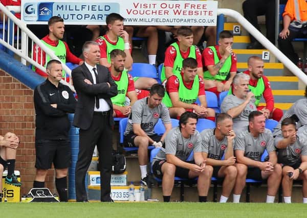 Posh boss Darren Ferguson watches from the sidelines as his side are beaten by Fleetwood at the Weston Homes Stadium. Photo: Joe Dent/theposh.com.