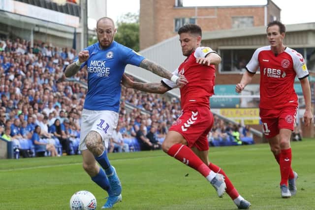 Marcus Maddison in action for Posh against Danny Andrew of Fleetwood. Photo: Joe Dent/theposh.com.
