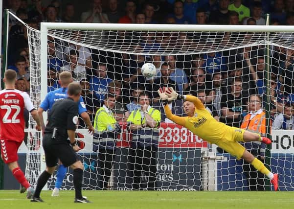Posh goalkeeper Christy Pym is beaten by Danny Andrew's late free kick during the 3-1 defeat at home to Fleetwood. Photo: Joe Dent/theposh.com.