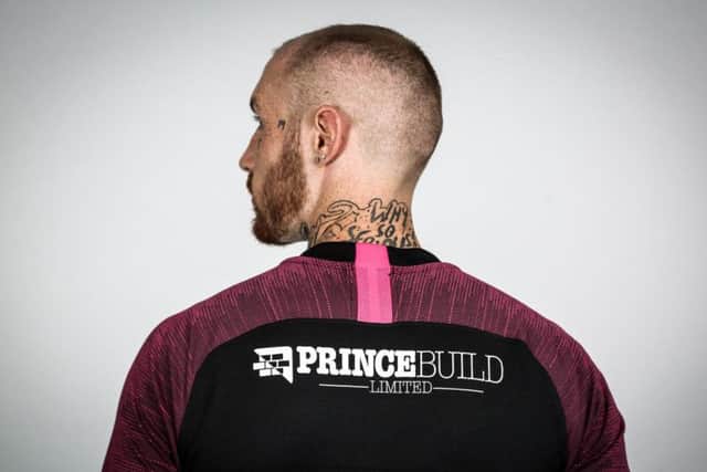 Marcus Maddison models the back of the new Posh away shirt. Photo: Joe Dent/theposh.com.