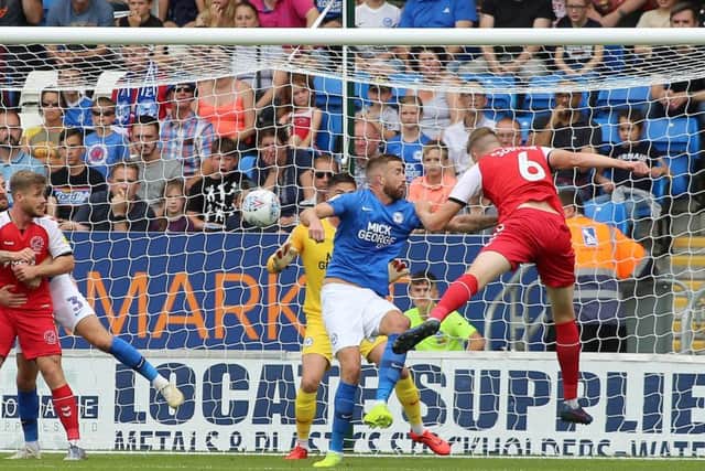 New Posh centre-back Mark Beevers is beaten to the ball by Fleetwood's Harry Souttar. Photo: Joe Dent/theposh.com.