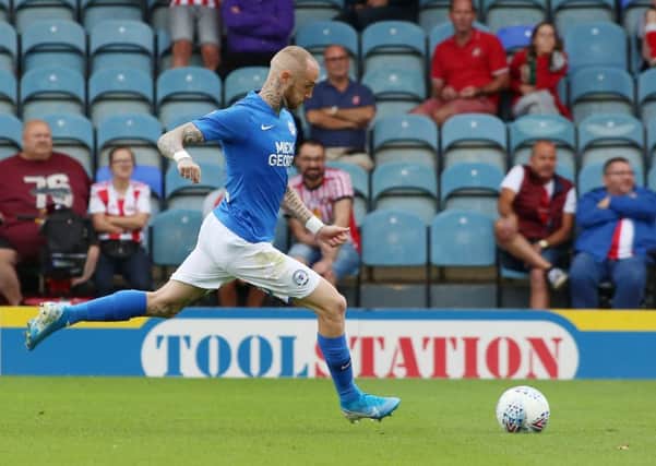 Marcus Maddison of Peterborough United scores the opening goal in a 3-0 win over Sunderland.