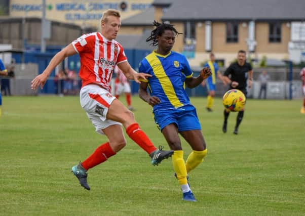 Manice Sani (blue) in action for Peterborough Sports againts Stourbridge at the weekend. Photo: James Richardson.