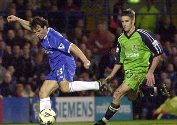 Adam Drury playing for Posh against Chelsea and Gianfranco Zola.