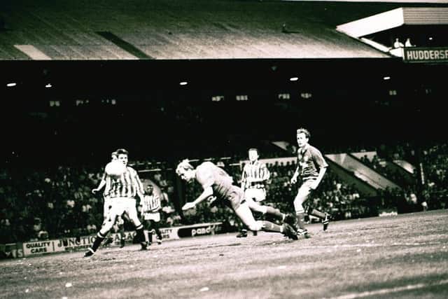 Steve Cooper scores for Posh at Huddersfield in a 1992 play-off match.