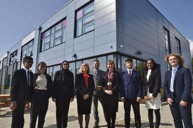Jack Hunt School headteachers  Pamela Kilbey and Kate Simpson with business manager Matthew Deere and sixth form prefects outside the school's new extension. EMN-190409-211015009