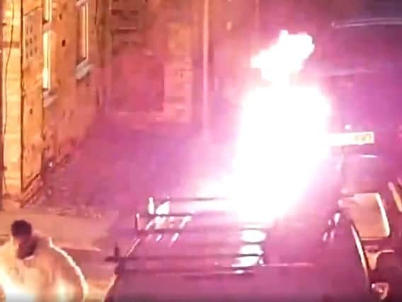 Michal Gregor setting fire to the car. Photo: Cambridgeshire police