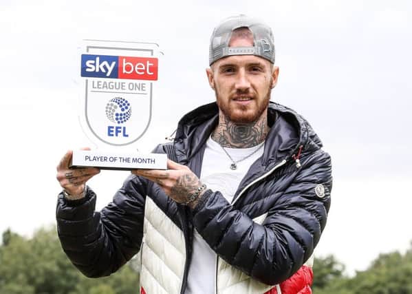 Marcus Maddison with his League One player-of-the-month award for August. Photo: Joe Dent/theposh.com.