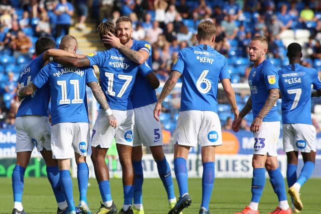 Posh players celebrate Marcus Maddison's stunning goal. Photo: Joe Dent/theposh.com.
