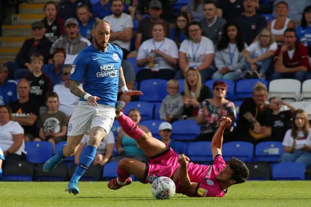 Marcus Maddison in action for Posh against Rochdale.