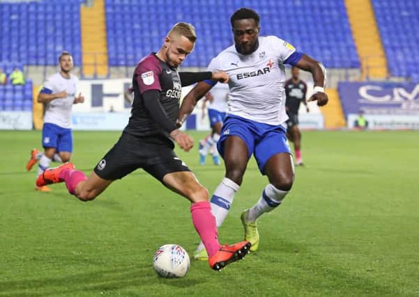 Joe Ward of Peterborough United in action with Emmanuel Monthe of Tranmere Rovers. Photo: Joe Dent/theposh.com