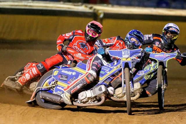 Ulrich Ostergaard (centre) and Scott Nicholls lead Panthers to a crucial 5-1 in the final heat against Wolverhampton. Photo: Jeff Davies.