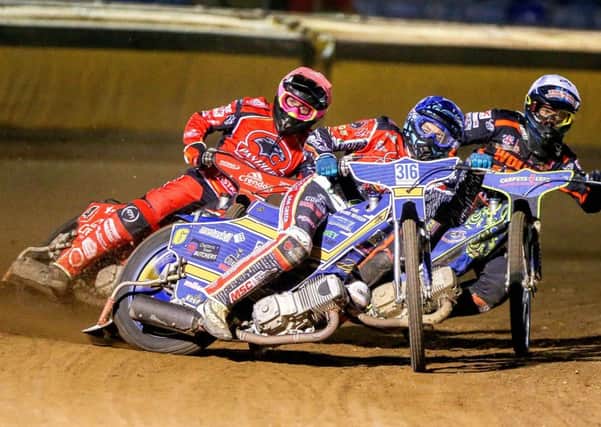 Ulrich Ostergaard (centre) and Scott Nicholls lead Panthers to a crucial 5-1 in the final heat against Wolverhampton. Photo: Jeff Davies.